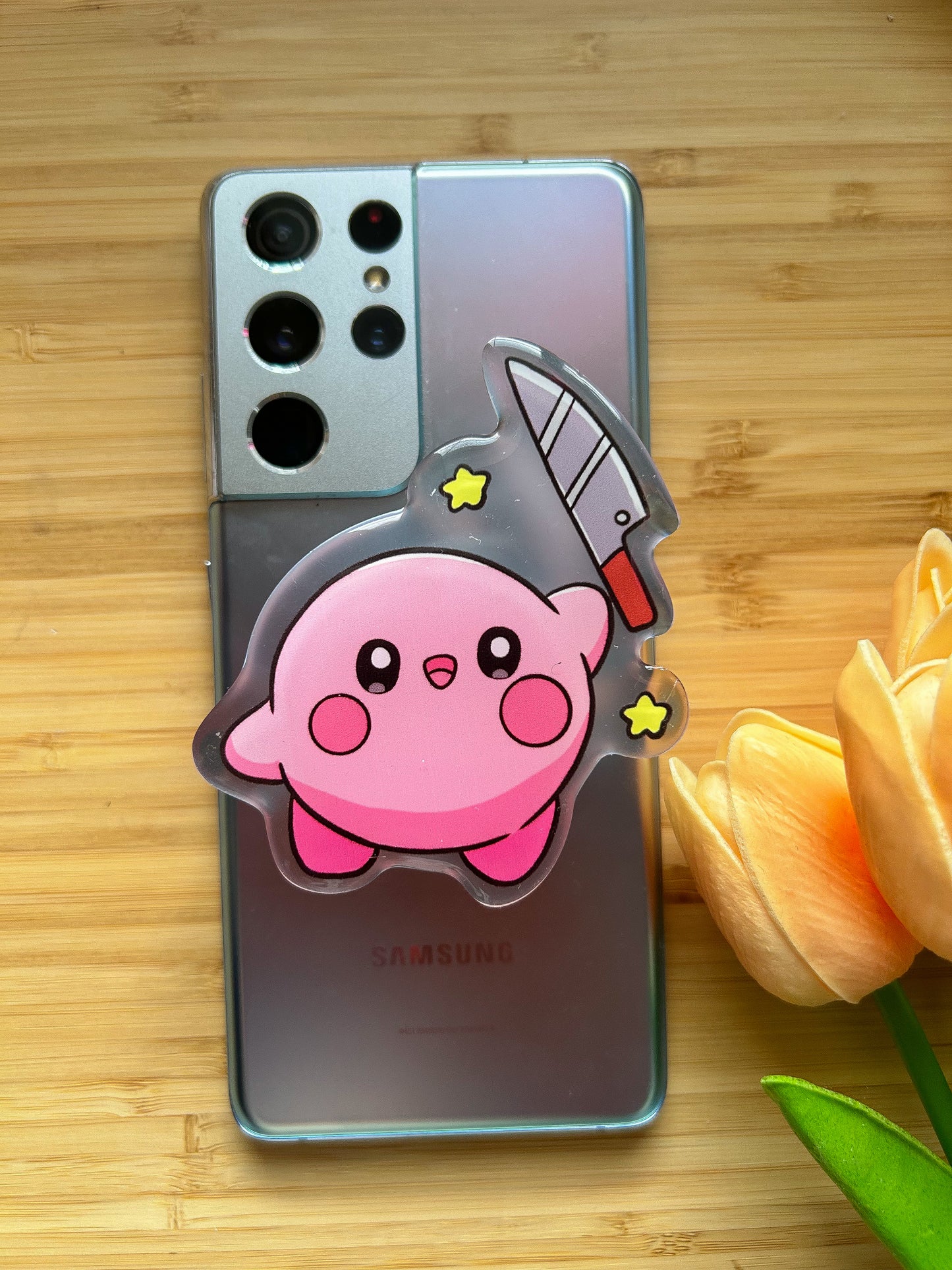 Kirby with knife phone grips