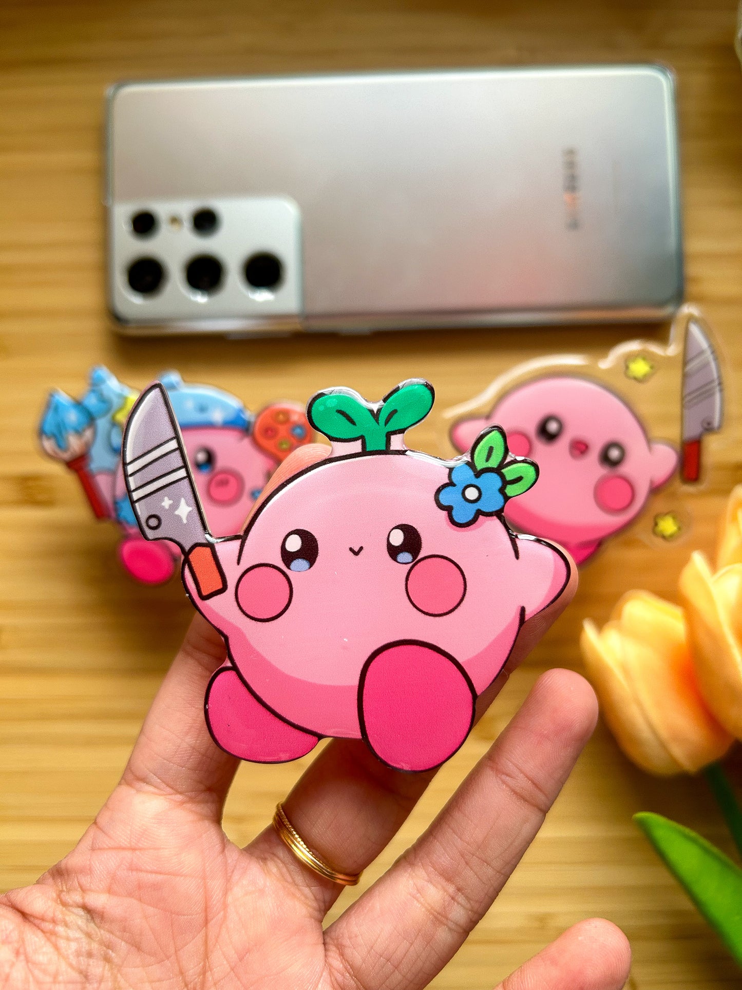 Kirby with knife phone grips